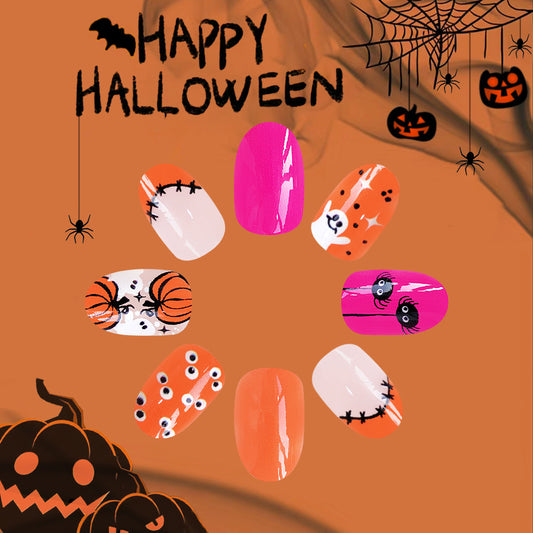 Spooky Elegance Medium Length Oval Press On Nails in Pink and Orange with Halloween-themed Art Design