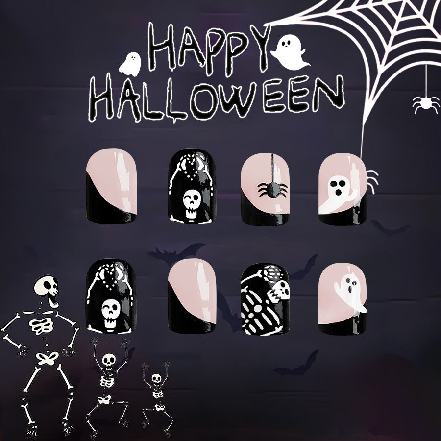 A set of Halloween-themed press-on nails featuring designs such as ghosts, skulls, and pumpkins, predominantly in black and beige colors.