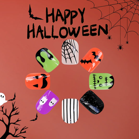 A set of press-on nails featuring various Halloween-themed designs including ghosts, pumpkins, and spider webs with glitter accents, displayed against a red background with a 'Happy Halloween' text.