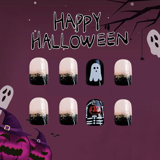 A set of press-on nails with a Halloween theme, featuring designs such as ghosts, skeletons, and pumpkins on a dark background.