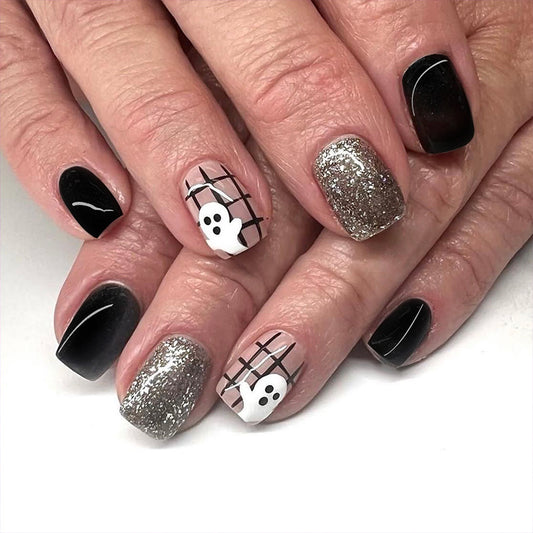 Spooky Elegance Short-Length Square Press-On Nail Set in Black and White with Silver Glitter Accents and Ghostly Design