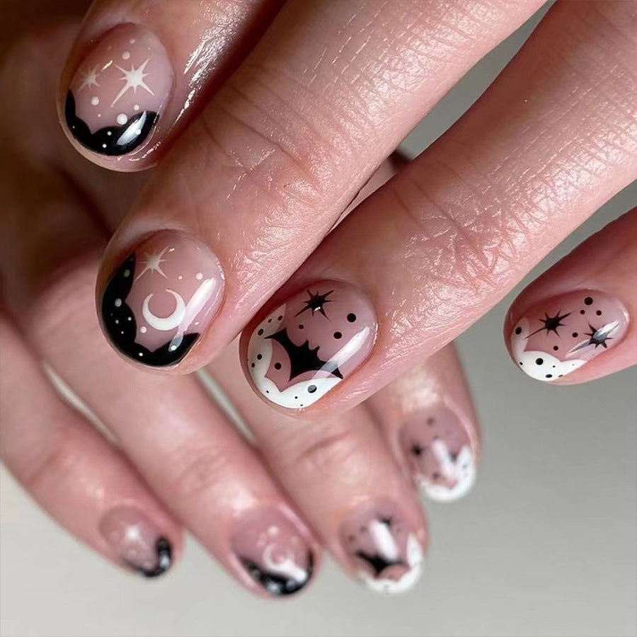 Cosmic Elegance Short-Length Oval Black and White Celestial Design Press On Nail Set