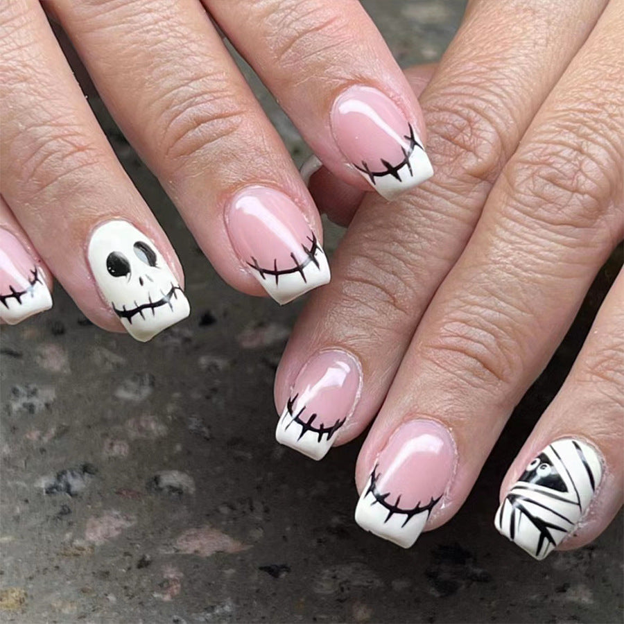 Spooky Elegance Medium Square Pink and White Press On Nail Set with Cartoon Skeleton Accents