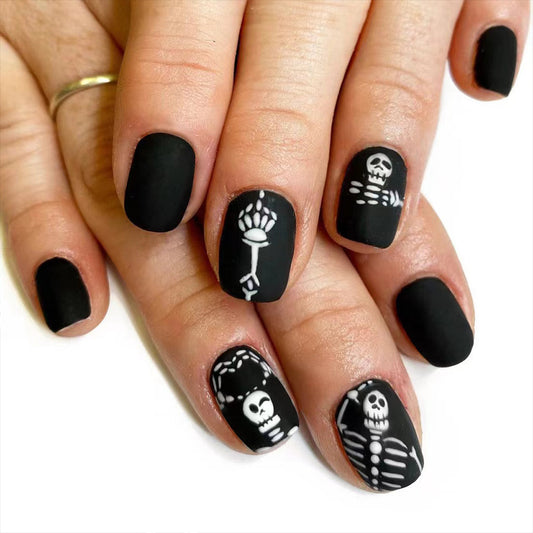 Gothic Elegance Short Length Oval Matte Black Press On Nail Set with Skeleton Design