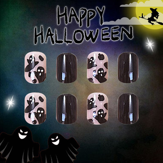A set of Halloween-themed press-on nails featuring a short square shape with a black and pink color scheme and ghost patterns.