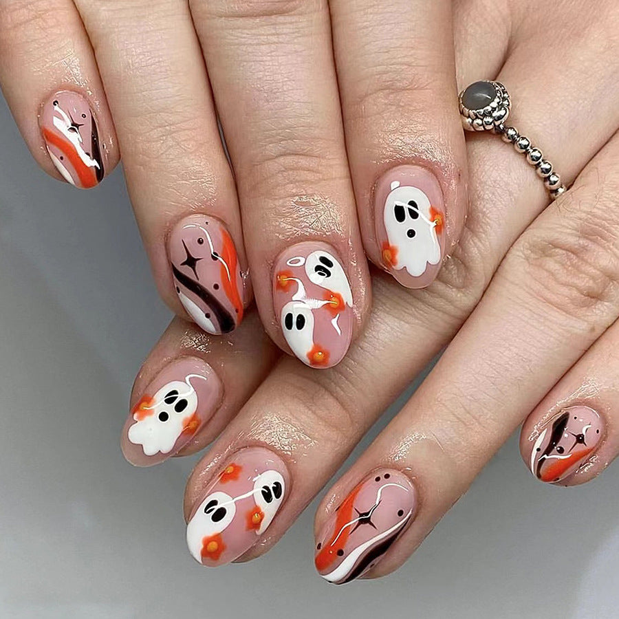 Spooky Elegance Medium-Length Oval Peach Press On Nail Set with Ghostly Charms and Glitter Accents