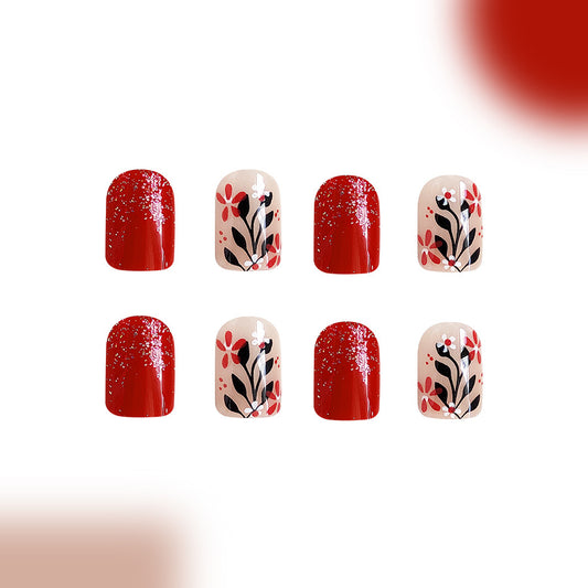 Floral Fantasy Short Oval Red Press On Nail Set with Sparkling Accents and Botanical Design