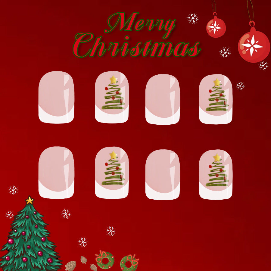 A set of press-on nails featuring a Christmas tree design in each nail, with the word 'Merry Christmas' at the top and decorative elements like snowflakes and Christmas ornaments around the border.