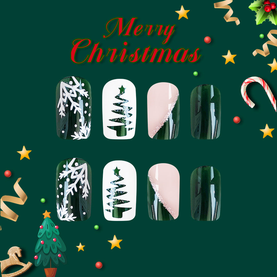 A set of four press-on nails with Christmas-themed designs, including holiday greetings and winter imagery.