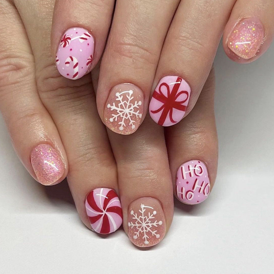 Holiday Sweet Treats Short Oval Pink and Red Candy Themed Press On Nail Set with Glitter and Festive Designs