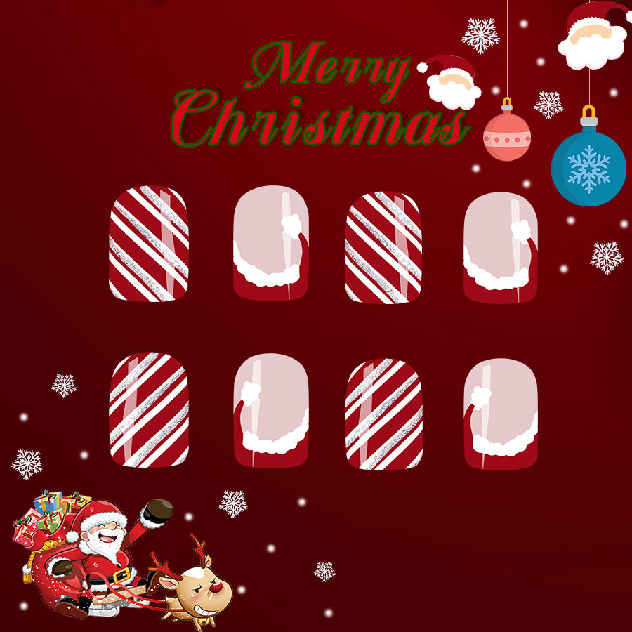 Nail art design with candy cane patterns on a Christmas-themed background
