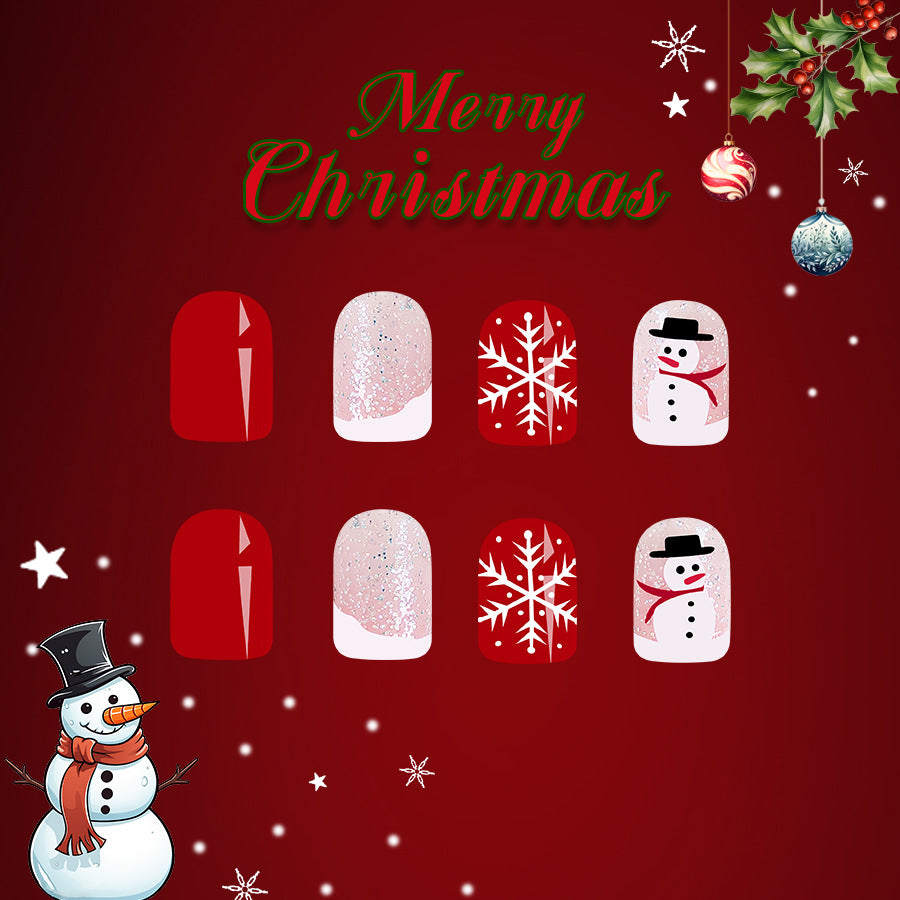 A set of red square press-on nails with a Christmas theme, including designs with a snowman, snowflakes, and the text 'Merry Christmas'.