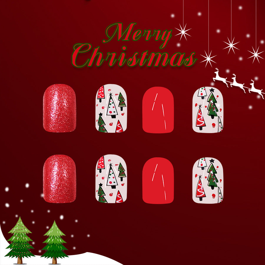 A set of press-on nails featuring a red glitter base with various Christmas-themed designs, including snowflakes, trees, and Santa Claus.