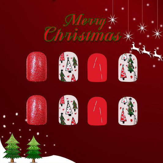 A set of press-on nails featuring a red glitter base with various Christmas-themed designs, including snowflakes, trees, and Santa Claus.
