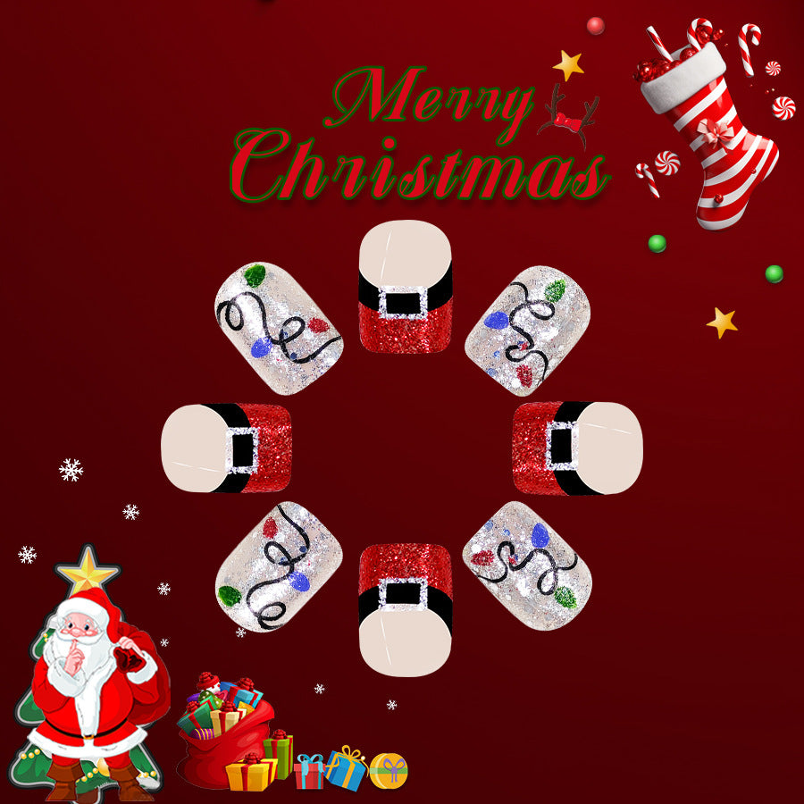 A set of press-on nails featuring a Christmas-themed design with red and silver glitter, presented on a festive background.