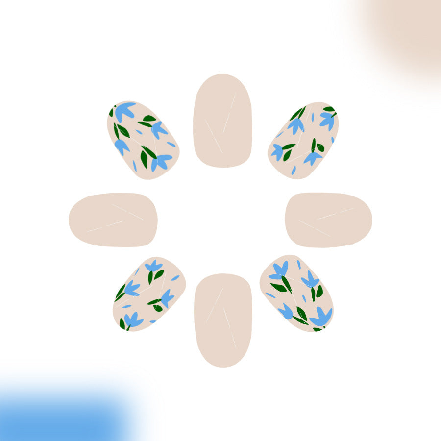 Whimsical Floral Dream Medium Oval Beige with Delicate Blue and Green Floral Accents Press on Nail Set