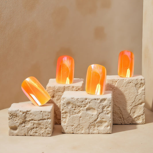 Radiant Sunset Inspiring Short Square Press On Nail Set in Warm Orange with Iridescent Glow