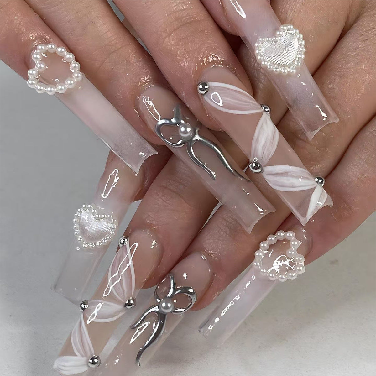 Whimsical Elegance Long Square White Press On Nail Set with Unique Heart and Pearl Embellishments