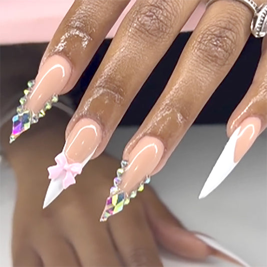 Whimsical Dream Press-On Nail Set in Long Stiletto Shape with Soft Pink and White Color Featuring Sparkling Rhinestones and Charming Bow Embellishment