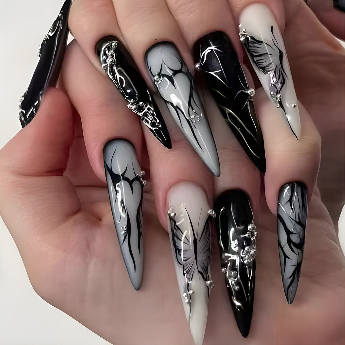 Mystical Elegance Long Stiletto Black and Gray Press On Nail Set with Unique Floral Designs and Gem Accents