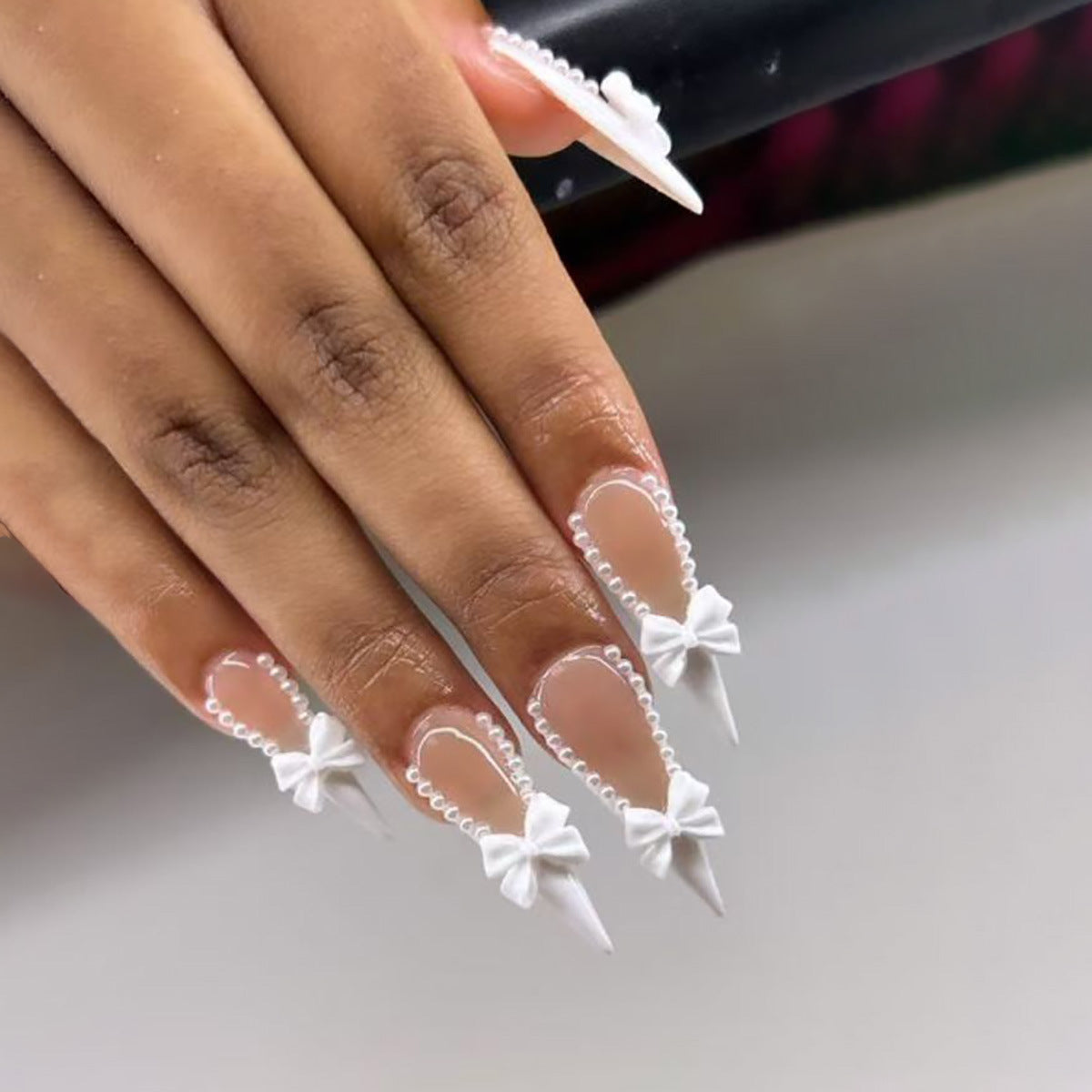 Elegant Whimsical Long Stiletto Press On Nail Set in White with Pearl and Bow Embellishments