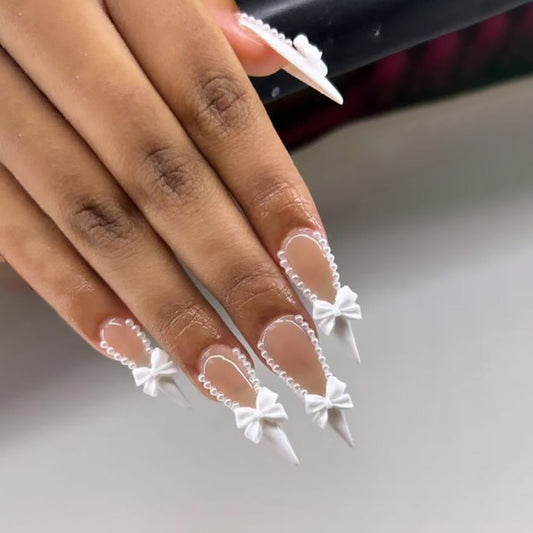 Elegant Whimsical Long Stiletto Press On Nail Set in White with Pearl and Bow Embellishments