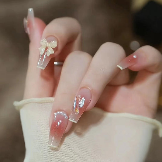 Chic Blush Elegance Long Coffin Clear Ombré Design with Adorable Bow and Sparkling Accents