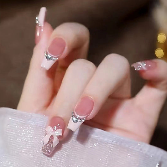 Charming Princess Inspired Long Coffin Pink Nail Set with Glittering Bow and Rhinestone Accents