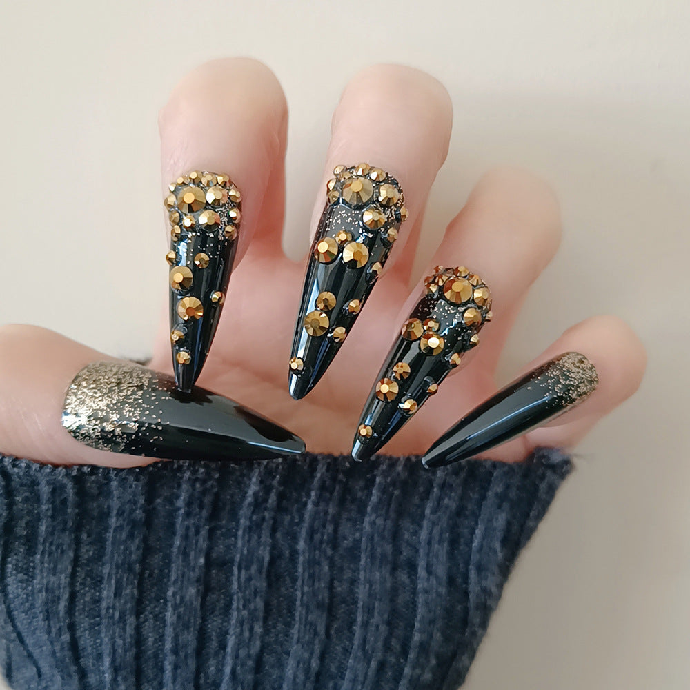 Glamorous Dark Elegance Long Stiletto Black Press-On Nail Set with Gold Crystal Accents and Sparkling Glitter Tips