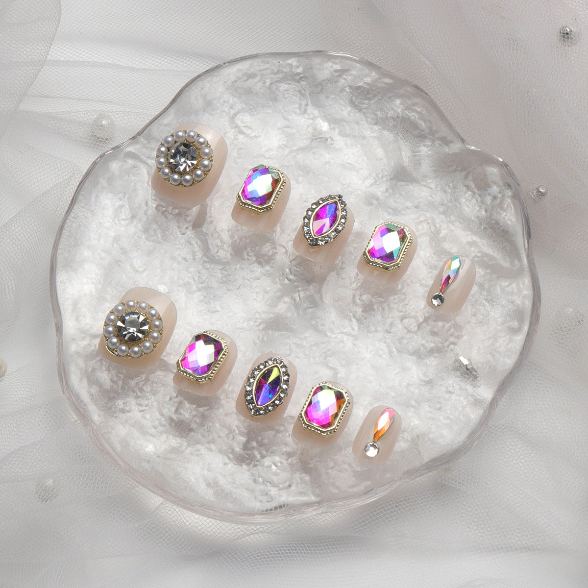 Glamorous Crystal Dreams Oval Blush Press On Nail Set with Short Length Variation and Iridescent Gemstone Accents