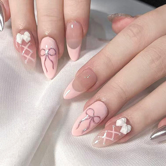Whimsical Elegance Medium Almond Pink Nails with Bow and Lace Design