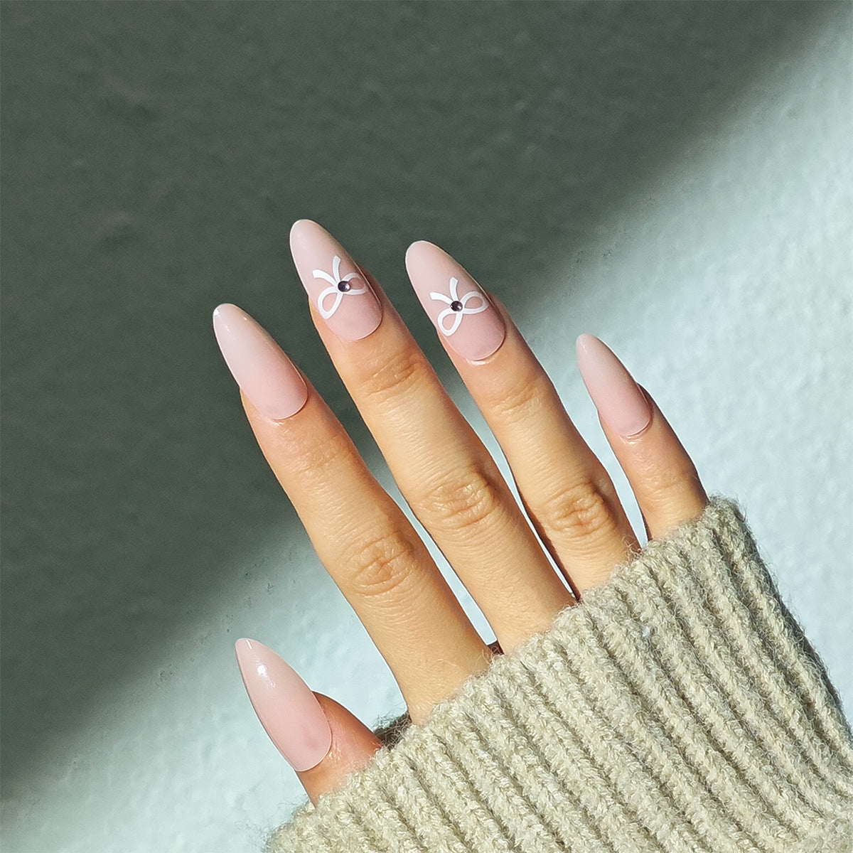 Chic Elegance Pink Long Oval Shaped Press On Nail Set with Charming Bow Designs