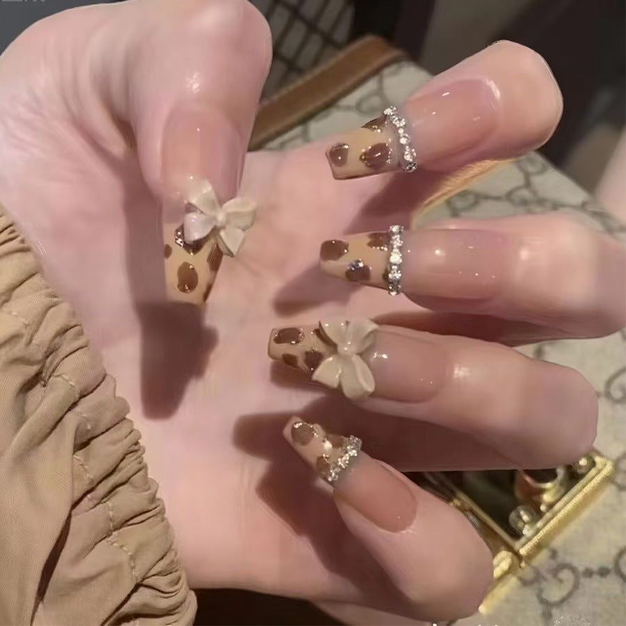 Chic Safari Inspired Long Coffin Brown Leopard Print Press On Nail Set with Elegant Floral Accents and Sparkling Rhinestone Detail