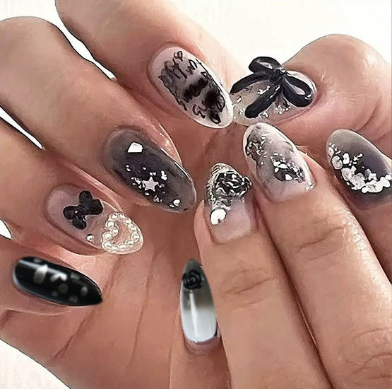 Gothic Elegance Medium Almond Black Press On Nail Set with Unique Textured Designs