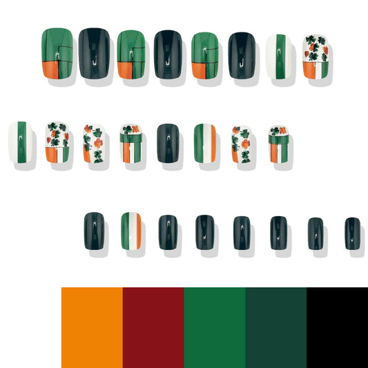 A set of false nails presented in a variety of designs featuring green, black, and white colors with unique shamrock patterns, indicative of Irish themes or St. Patrick's Day.