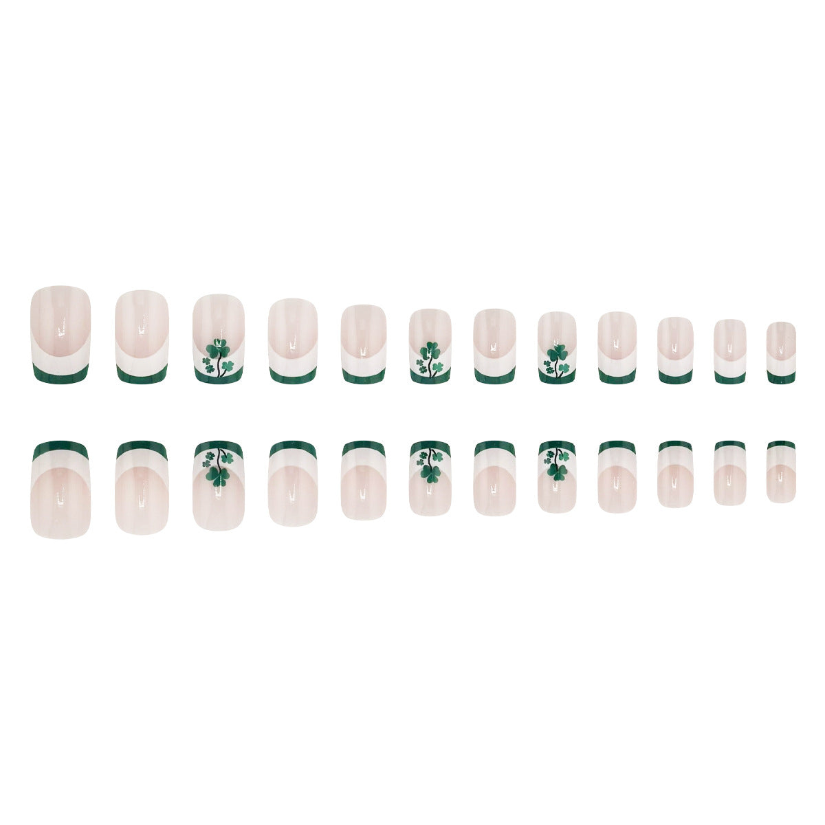 A set of false nails laid out in a row, featuring a clear nail polish base with a green stripe and shamrock design.