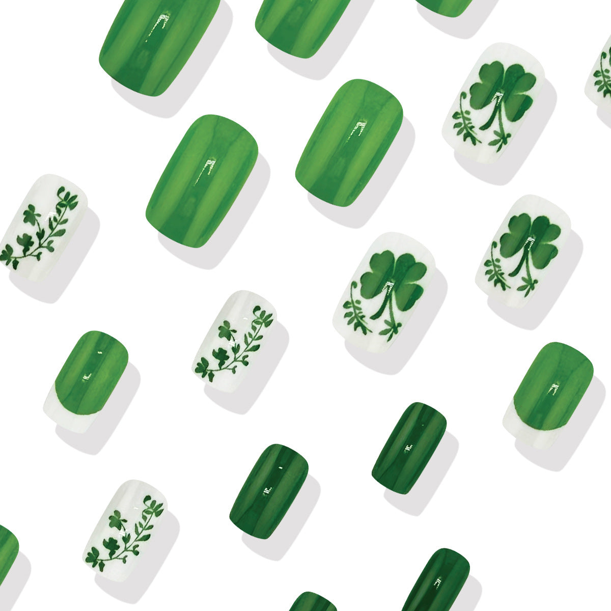 A set of nail art featuring short square nails with a green base and shamrock designs.