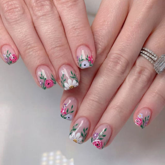 Nails with floral designs on a light background