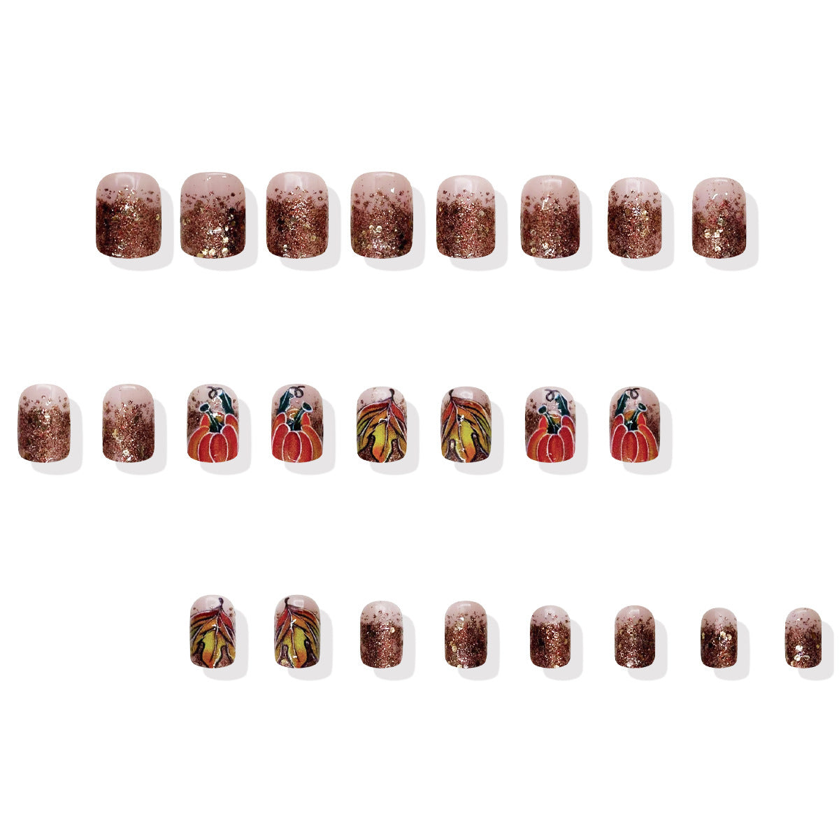 Set of nail art stickers with pumpkins and glittery design on a white background