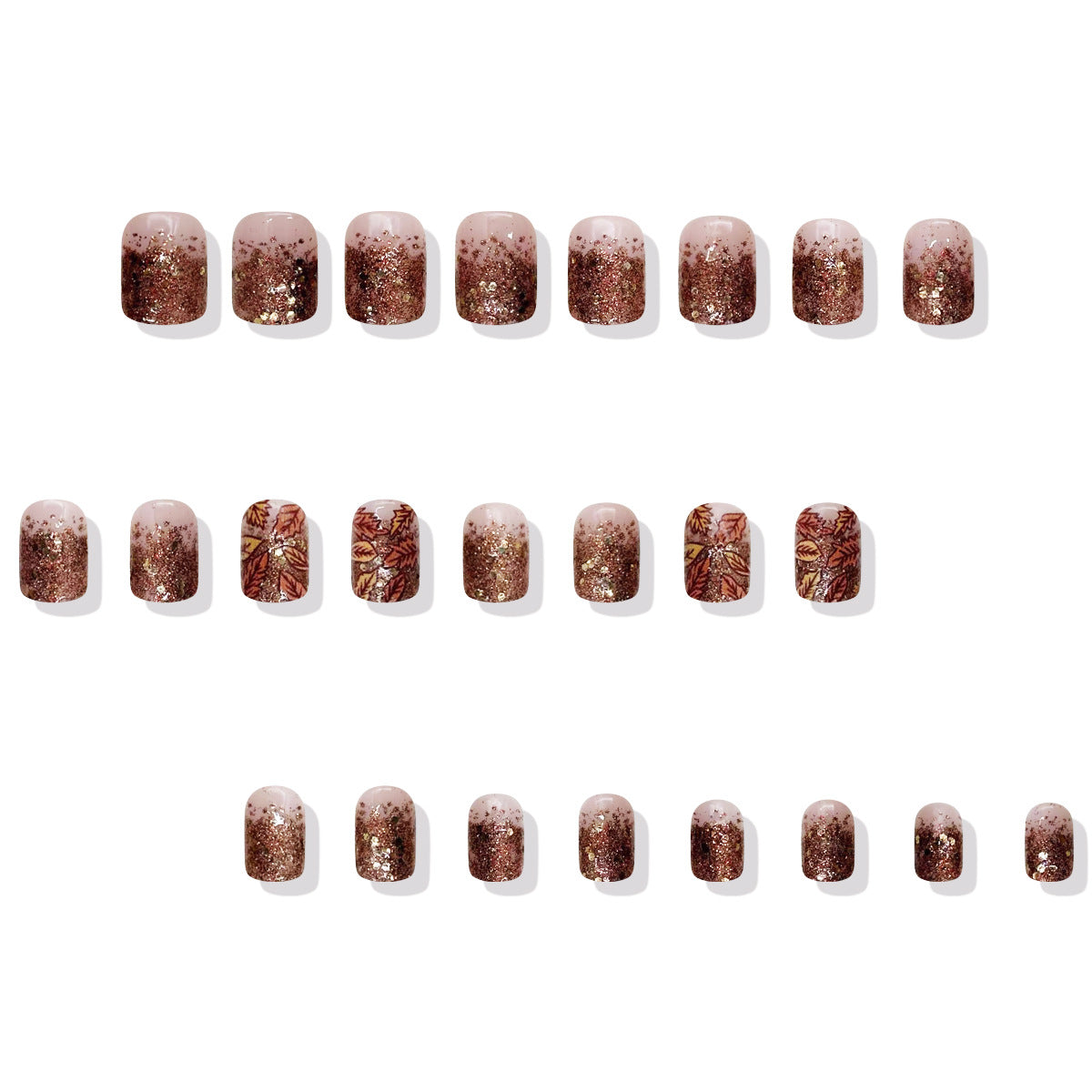 Row of glittery nail art stickers on a white background