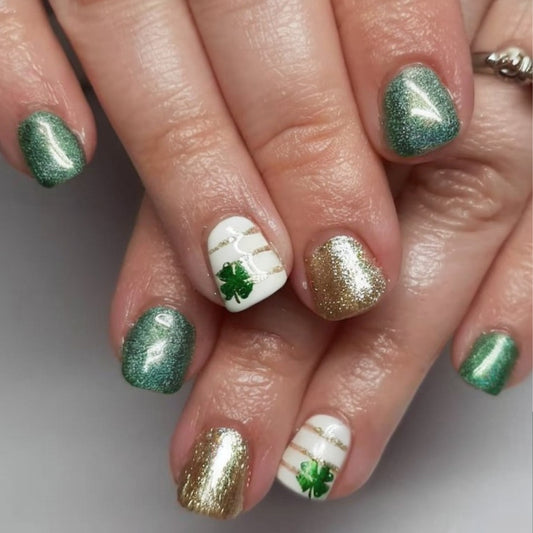 Festive Shamrock Dreams Short Square Green and Gold Glitter Press-On Nail Set with Unique White Accent Design