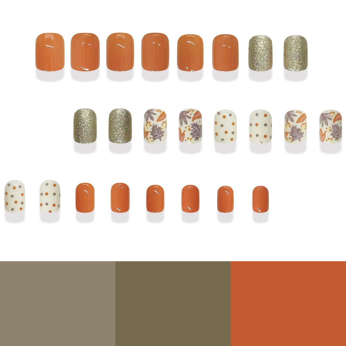 A collection of press-on nails featuring a variety of designs, including some with floral patterns and glitter accents, primarily in orange and white shades.