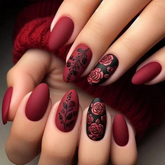 Whimsical Romance Medium Almond Matte Burgundy Press on Nail Set Featuring Intricate Floral Designs