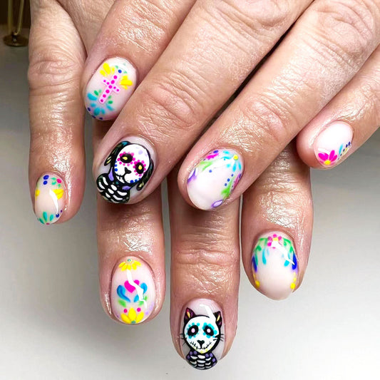 Day of the Dead Colorful Short Oval Press On Nail Set with Unique Sugar Skull Design and Vibrant Floral Accents