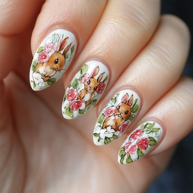 Nails with rabbit and floral design on a neutral background