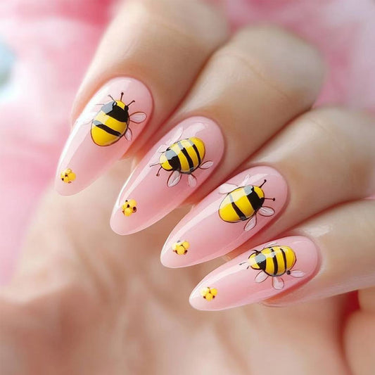 Buzzing Bee Inspired Long Almond Pink Nails with Vibrant Yellow Bee Art