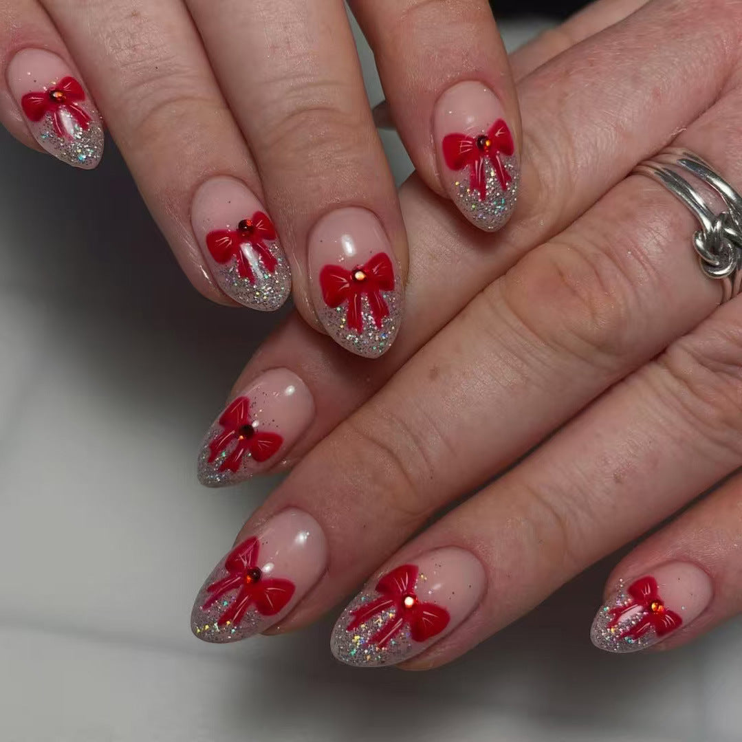 Festive Glamour Short Almond Pink with Red Bow Accents and Glitter Tips Press-On Nail Set