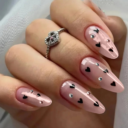 Romantic Elegance Long Almond Pink Nails with Heart Patterns and Rhinestone Accents