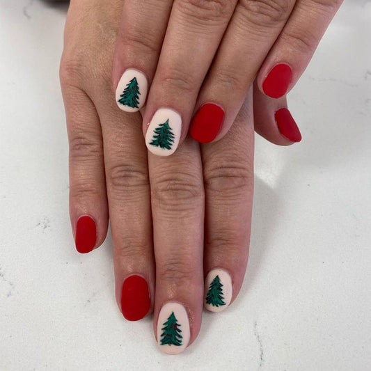 Festive Winter Wonderland Medium Oval Red and Cream Press On Nail Set with Christmas Tree Designs