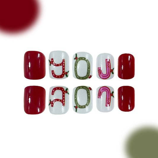 Festive Holiday Charm Medium Oval Red and White Press On Nail Set with Unique Lettering Design
